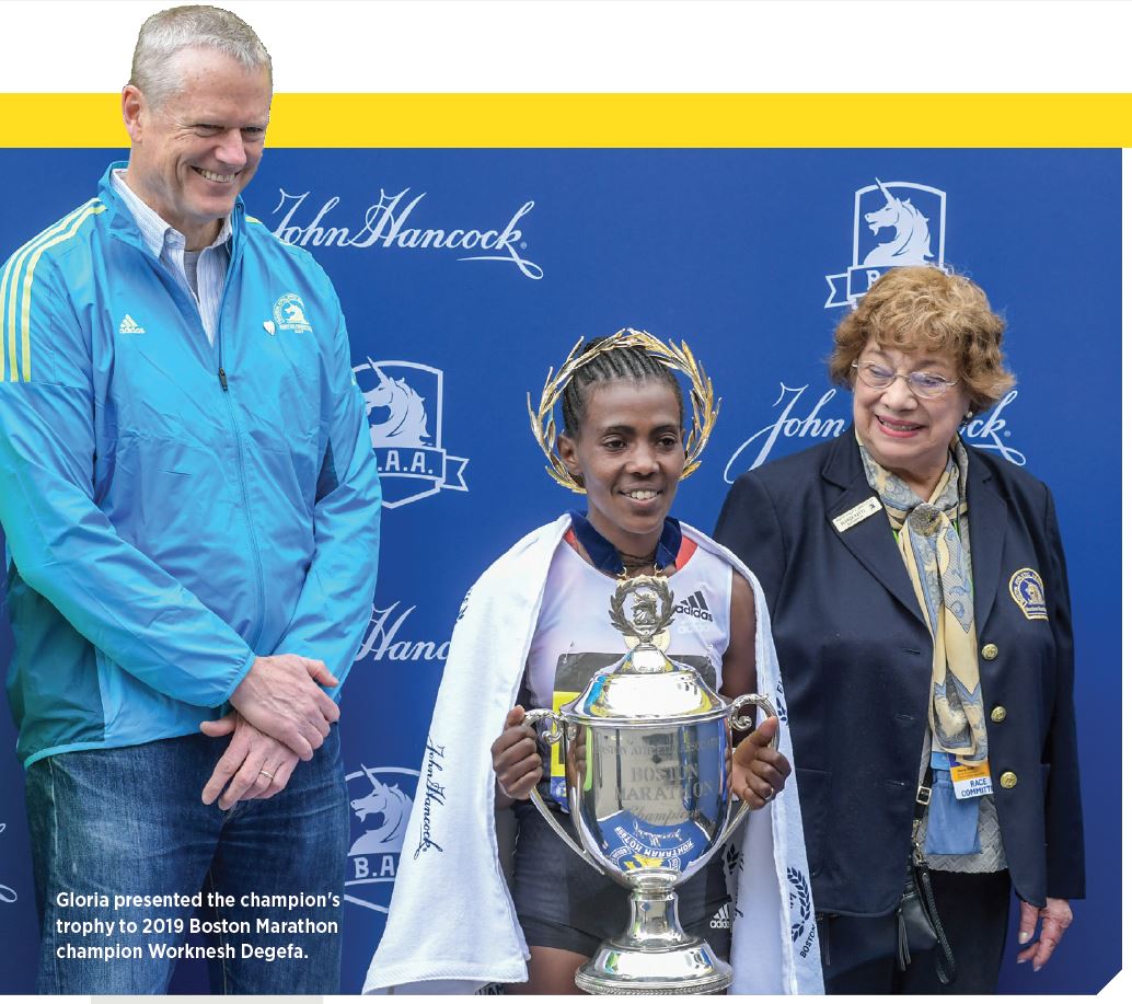 Gloria presented the champion's
trophy to 2019 Boston Marathon
champion Worknesh Degefa.