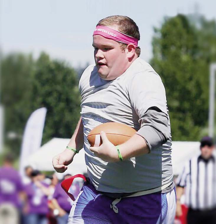 BOY PLAYING FOOTBALL