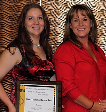 Fire Tech's Lisa Dumas (left) and Tracy Hadwin accepted a Regional Safety Award from NAWIC.