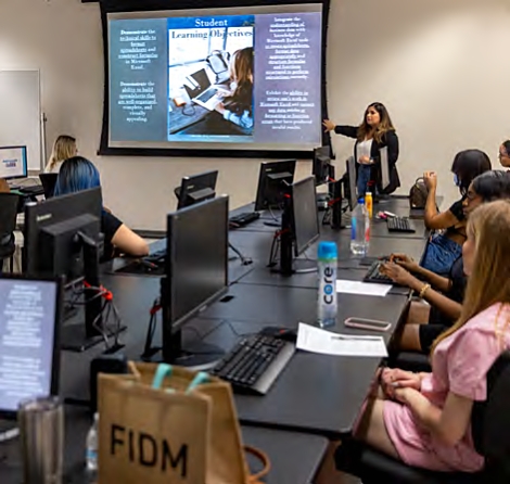 Instructor Samantha Garcia teaches students how to evaluate their business with Microsoft Excel; Class: Excel for Business Applications